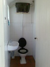 toilet_with_elevated_cistern_and_chain